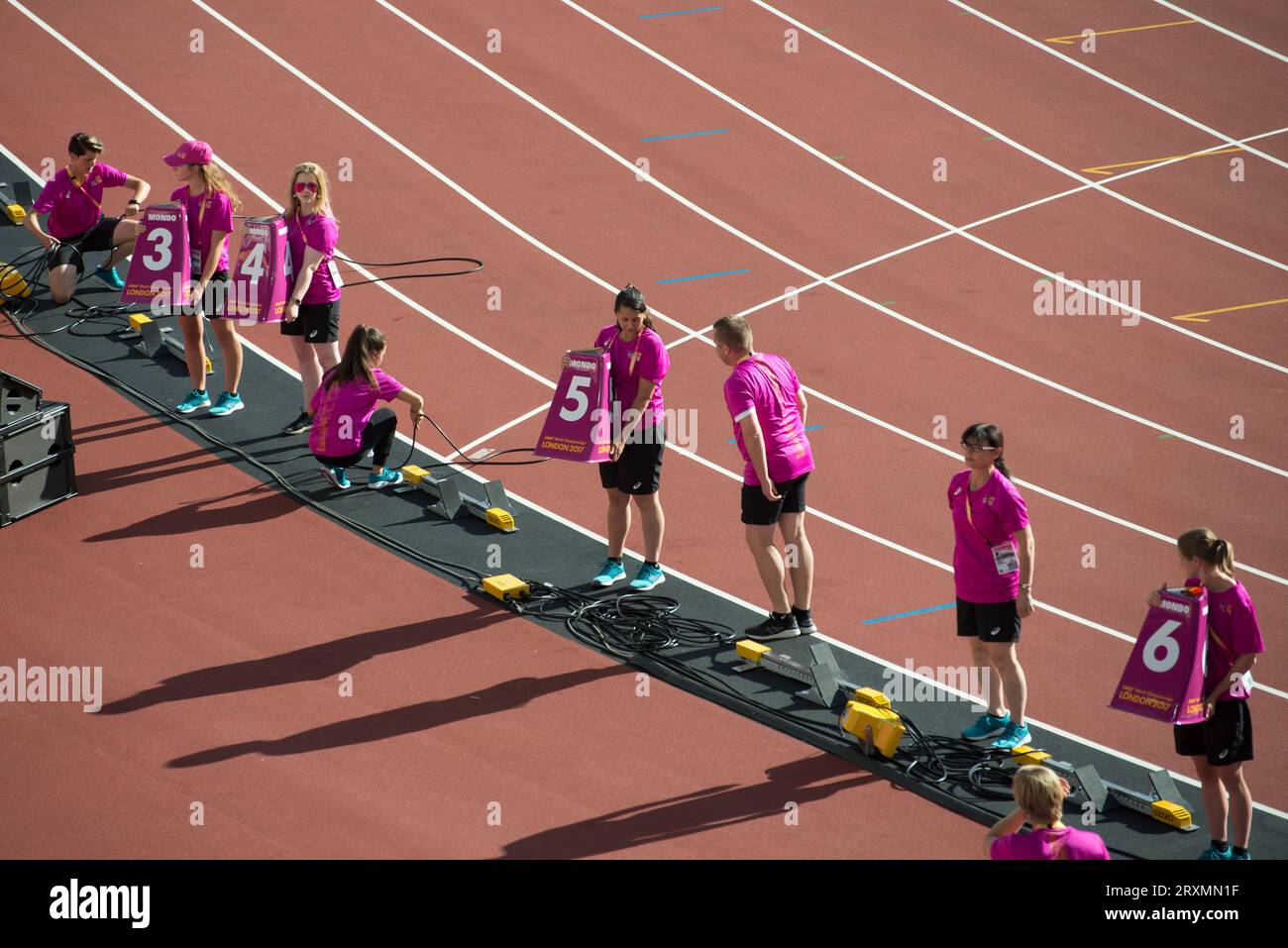 Track assistants laying out lane markers at the London 2017 World