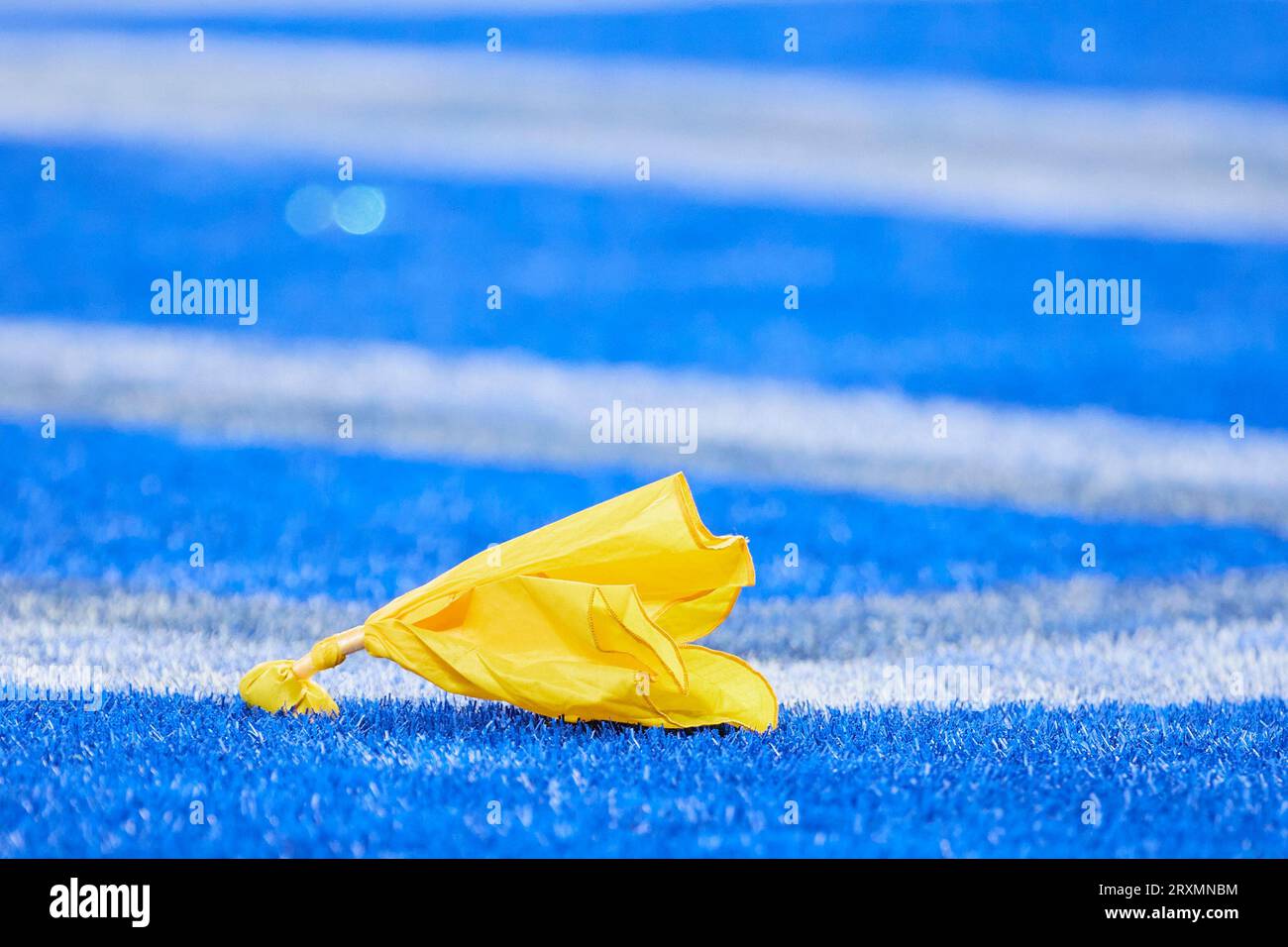 Penalty flag on the field during an NFL football game at Ford Field in