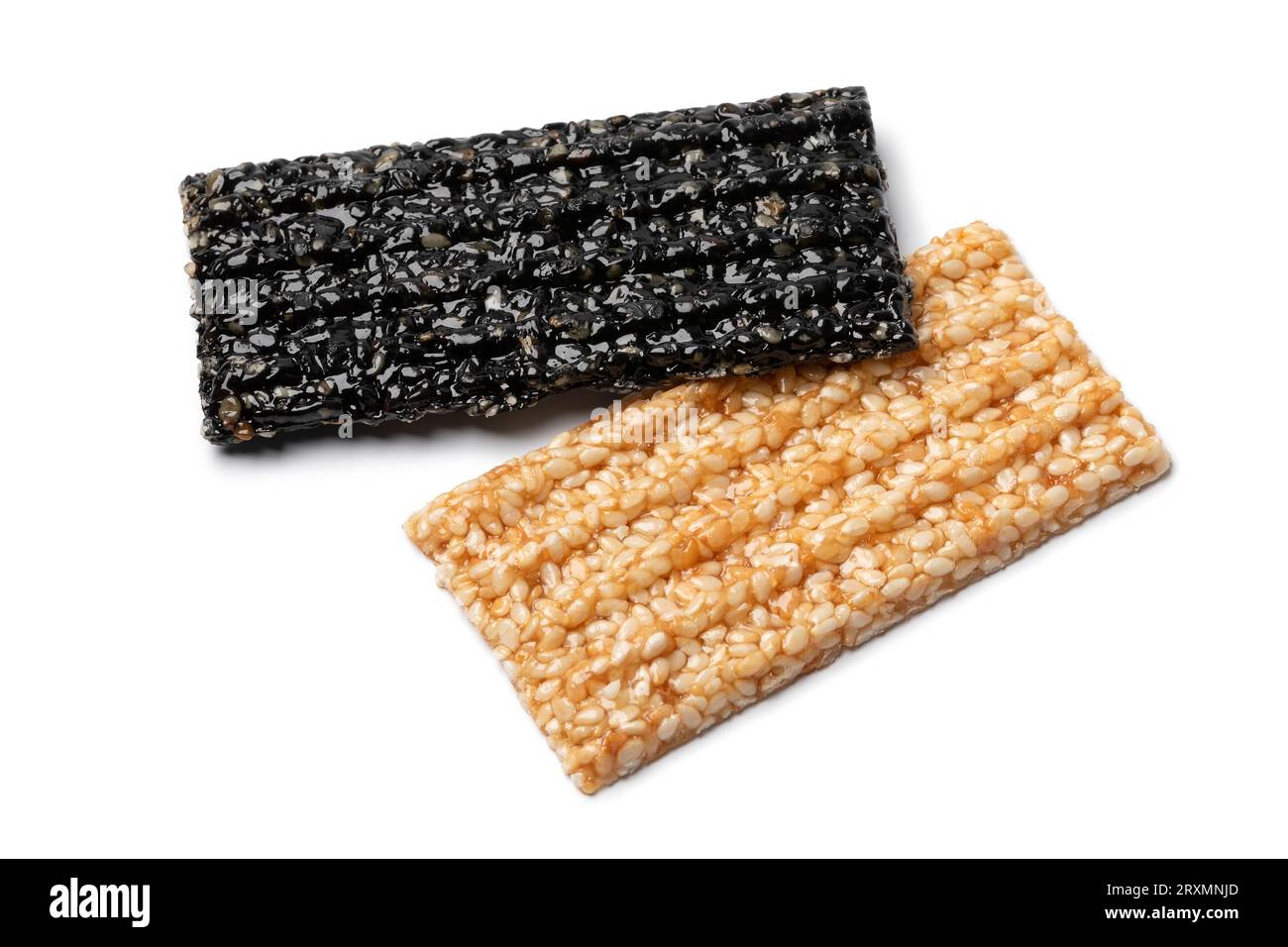 Pair of white and black of sesame snaps isolated on white background close up Stock Photo