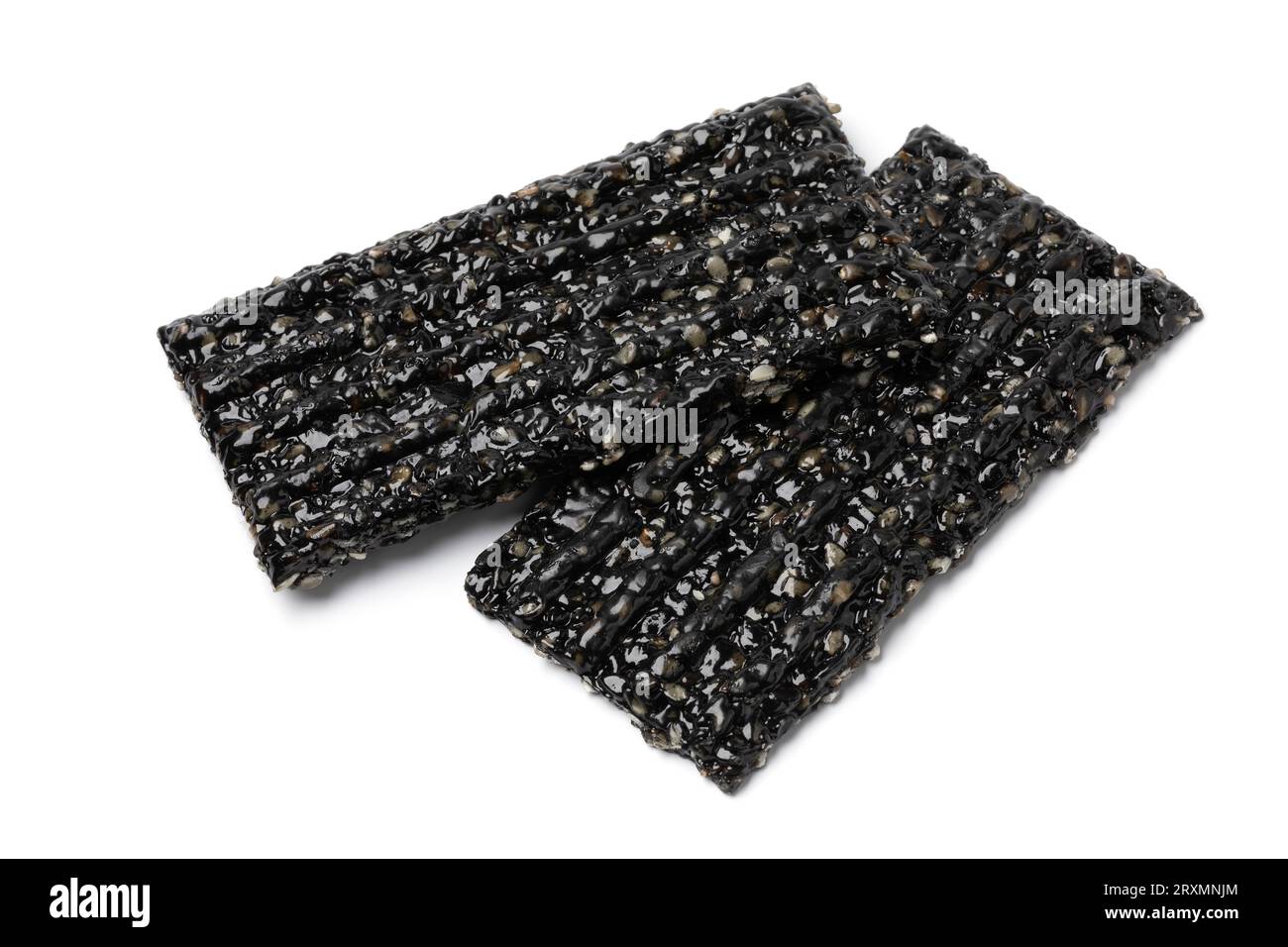 Pair of black sesame snaps isolated on white background close up Stock Photo