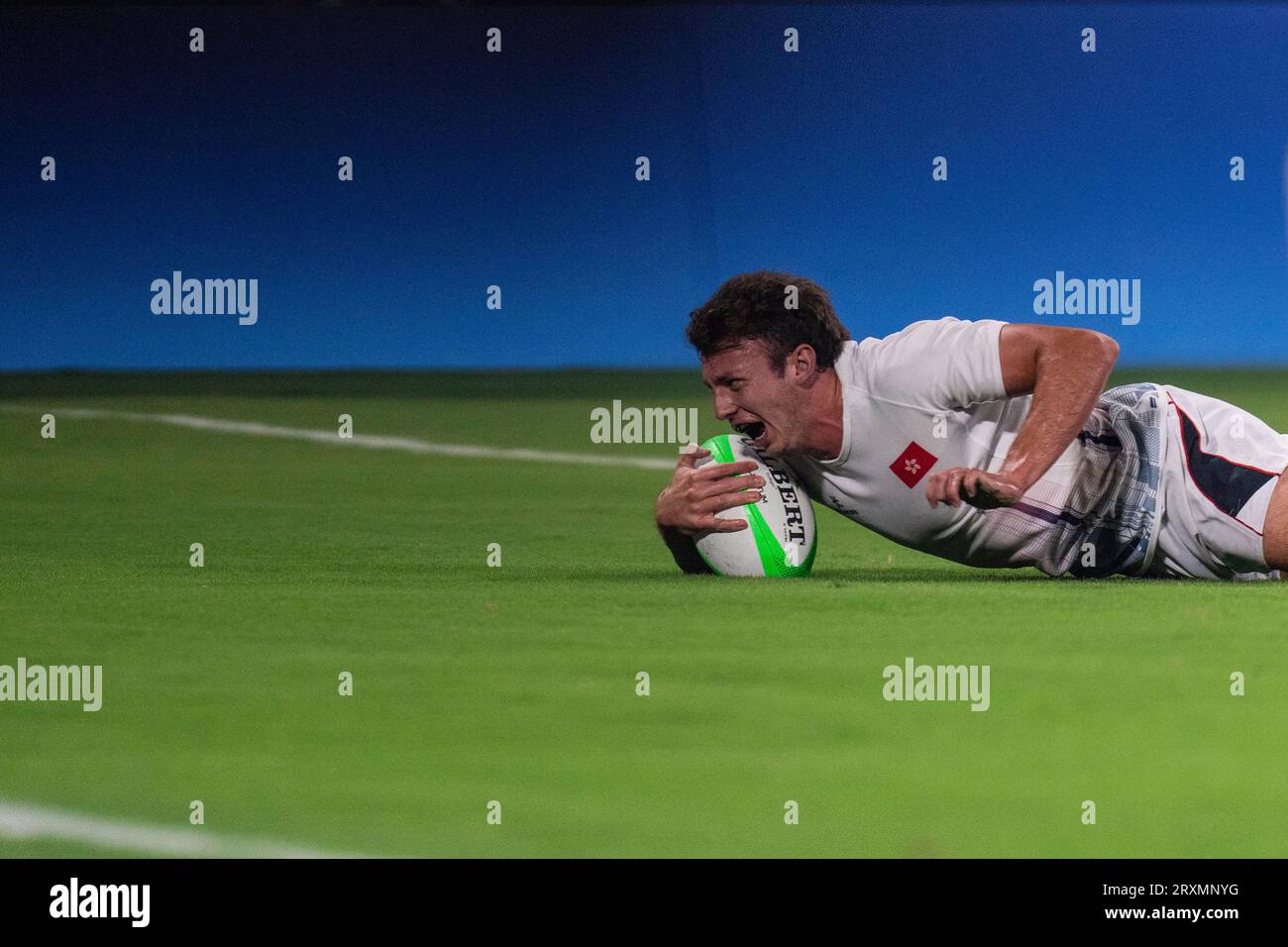 Hong Kong's Doherty Liam Martin scores a try during the men's final ...