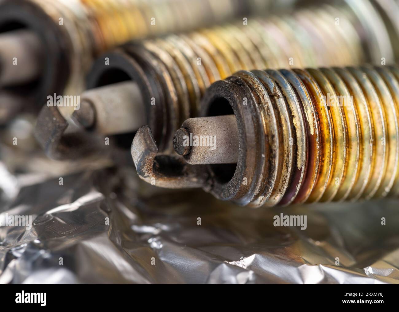 old very damaged car spark plugs, closeup of old used car spark plugs