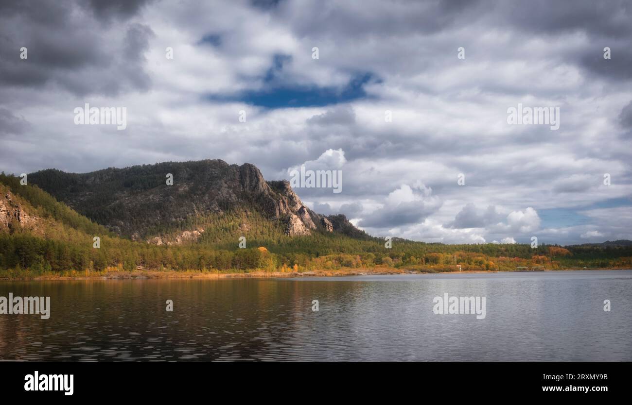 Pasheno Lake at the foot of the Karkaraly Mountains in Kazakhstan on sunny autumn day Stock Photo