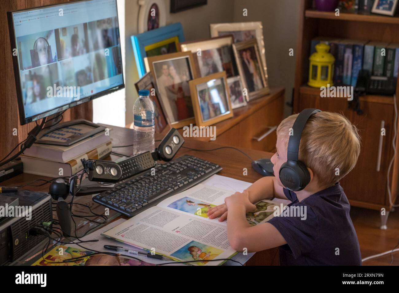 Young boy, first class primary school, studying with a distance ...