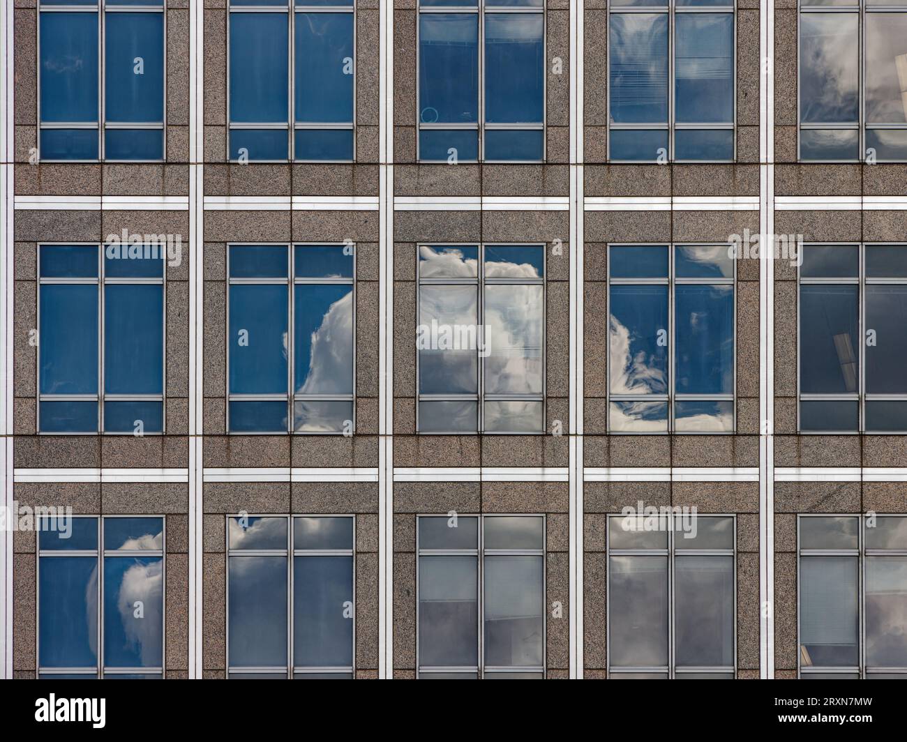 300 Vesey Street, home of New York Mercantile Exchange, joined Brookfield Place in 2013. By any name, its granite and glass façade reflects the sky. Stock Photo