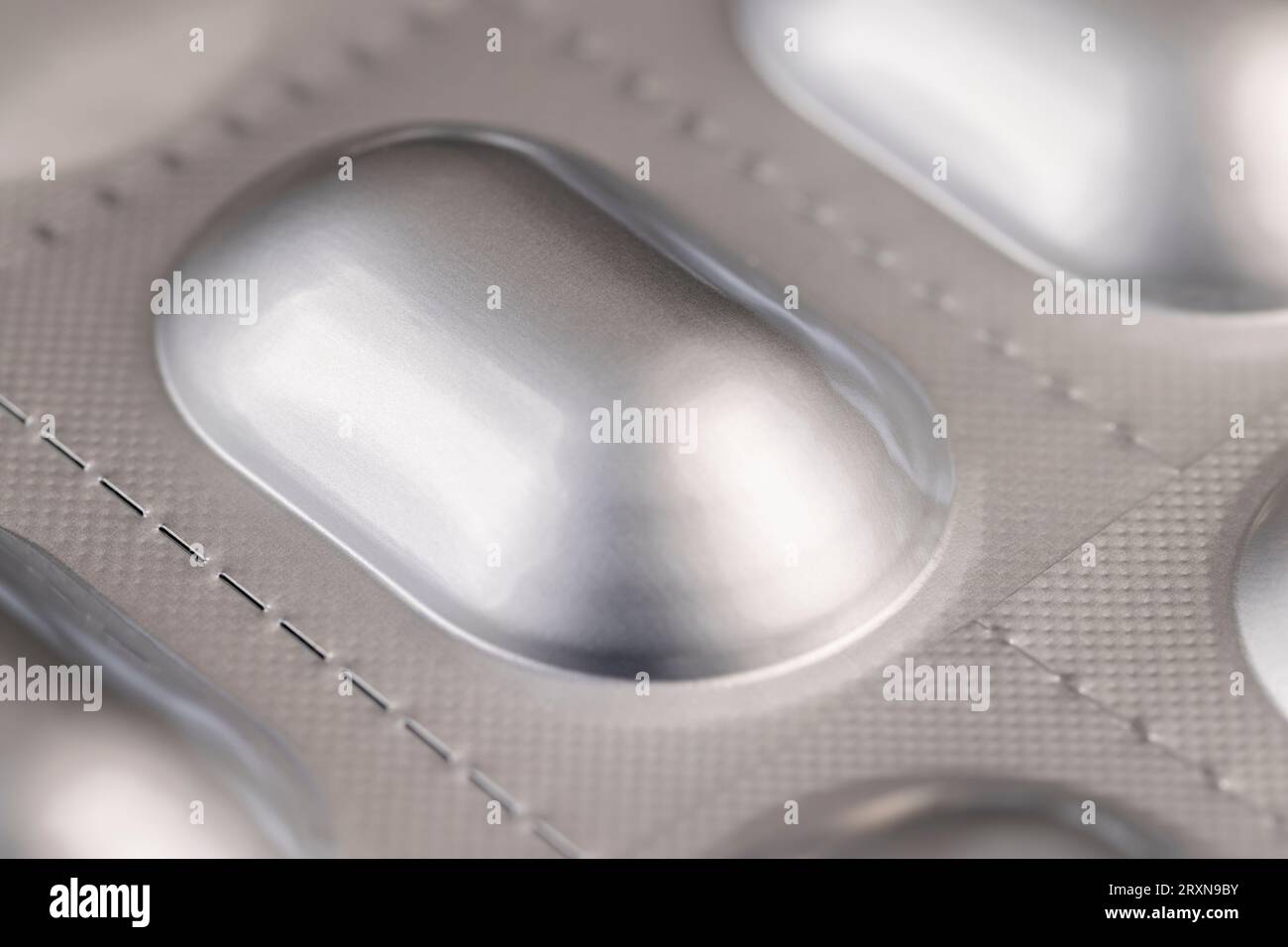 https://c8.alamy.com/comp/2RXN9BY/aluminum-blister-with-medicines-close-up-of-aluminum-foil-packaging-for-medicines-2RXN9BY.jpg