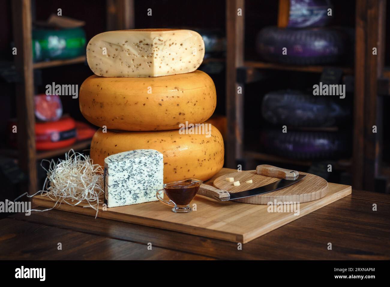 blue cheese, whole cheese head, pyramid of cheeses, Roquefort, Bleu de