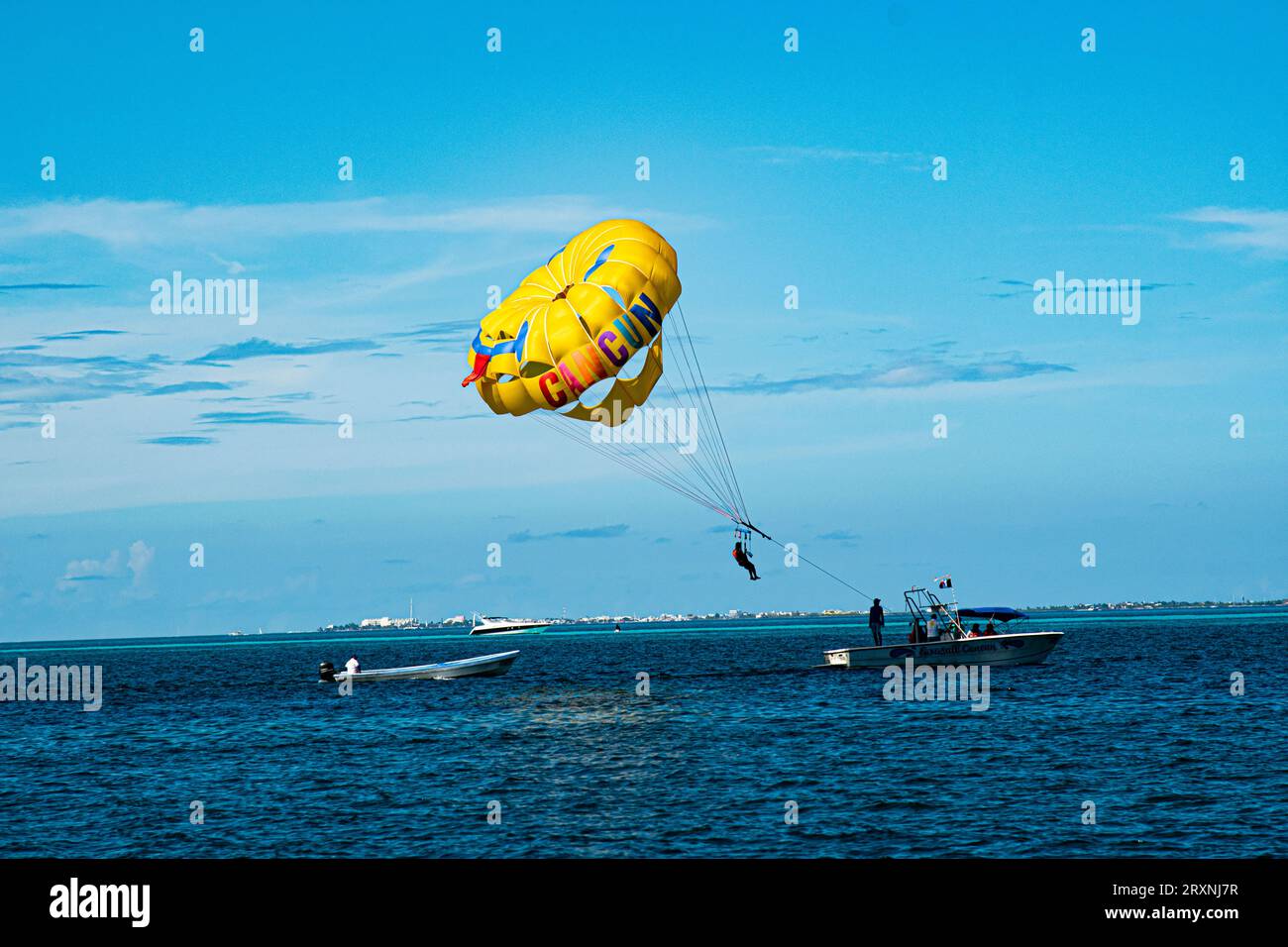 Paragliding sailing while vacationing in Cancun, Mexico. Stock Photo