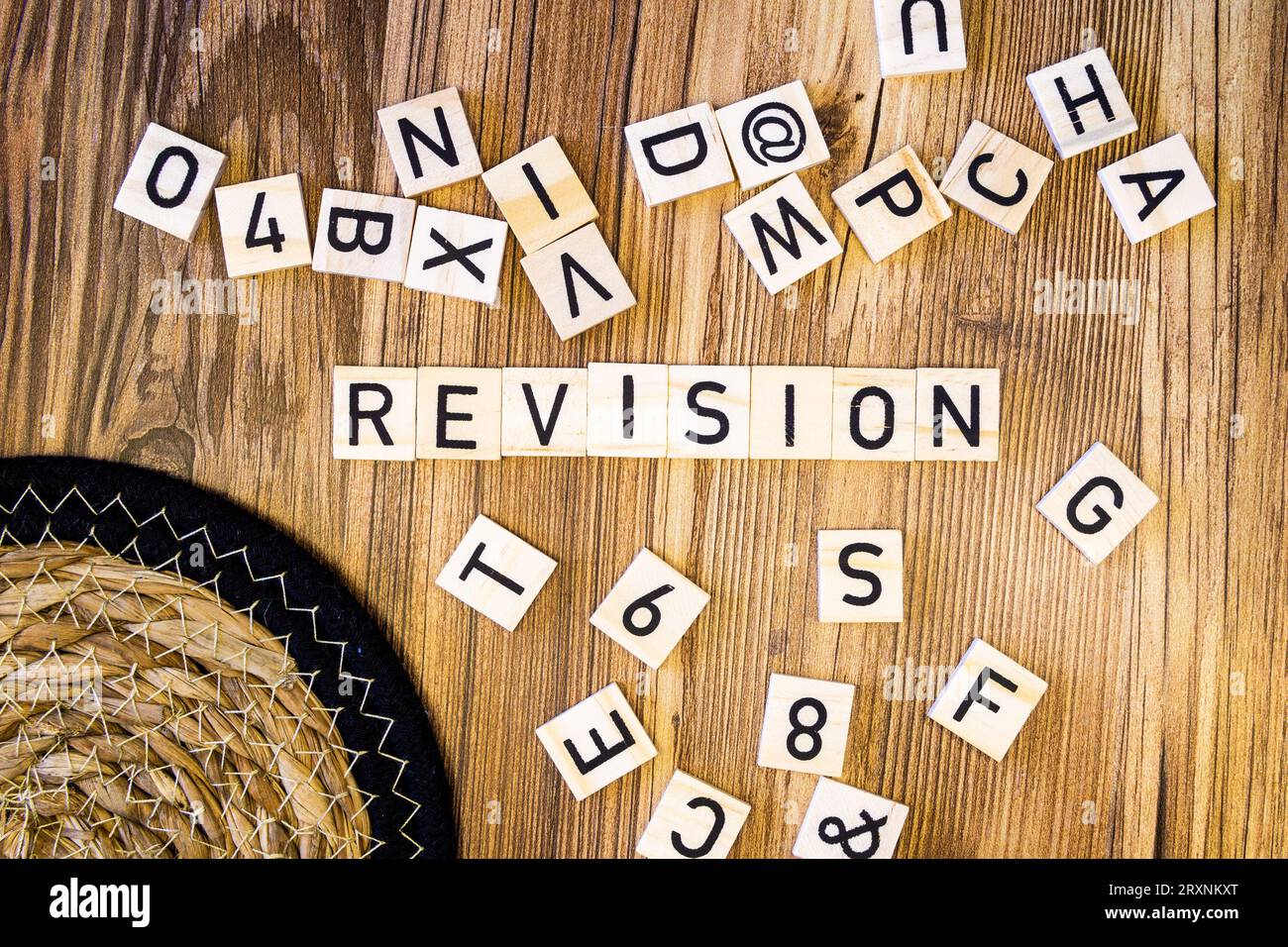 Revision flat lay scattered letters with straw mat Stock Photo