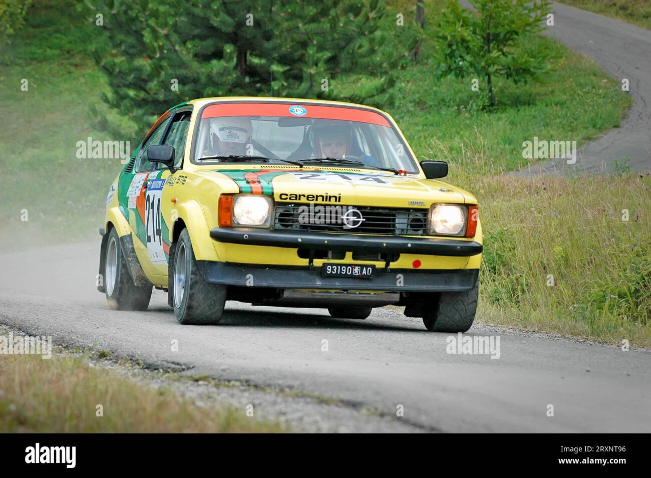 Italy - September 7, 2005 - Unidentified drivers on a yellow vintage Opel Kadett C Coupe racing car Stock Photo