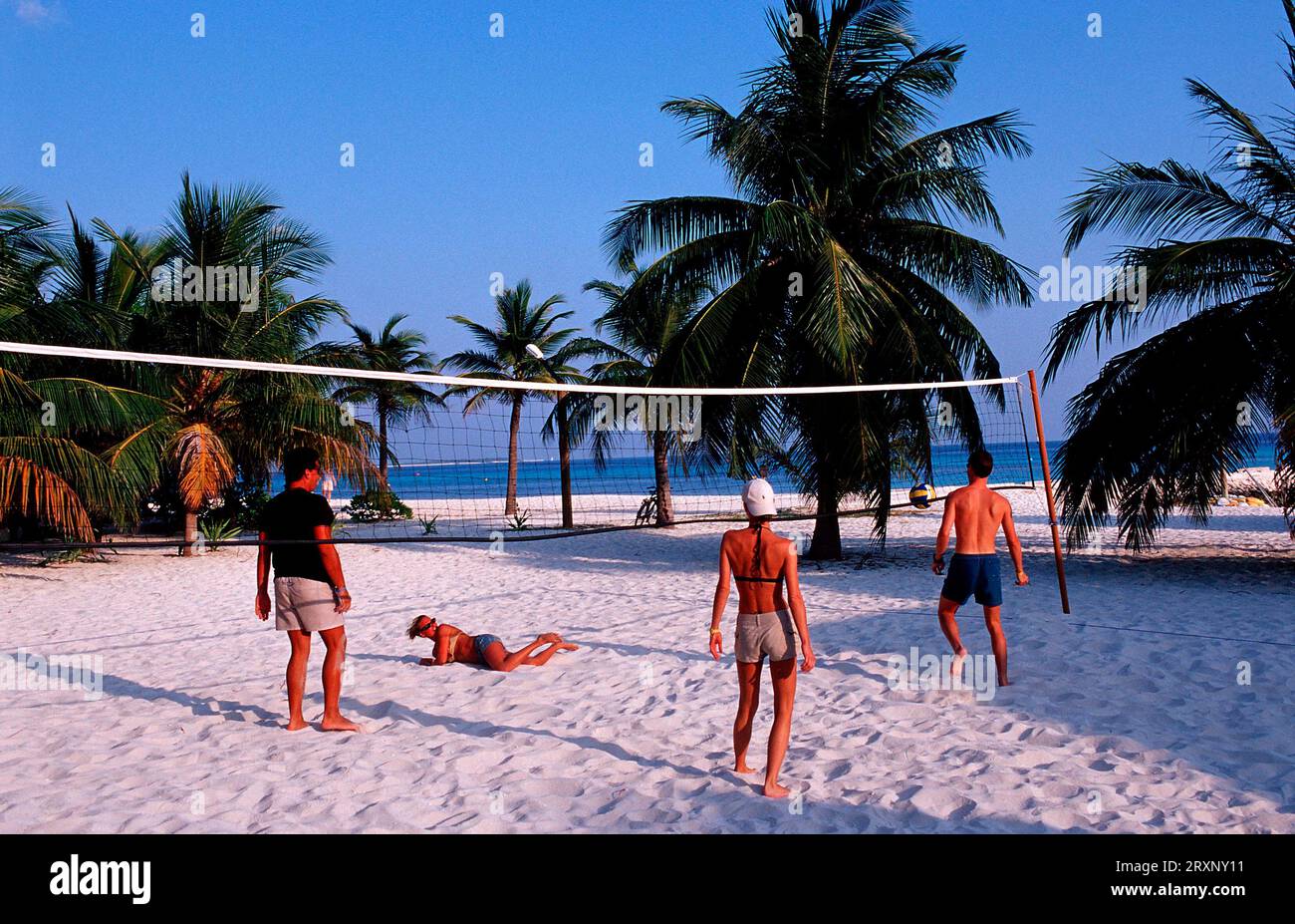 Holidaymakers playing beach volleyball, Lhaviyani Atoll, Kuredu Island