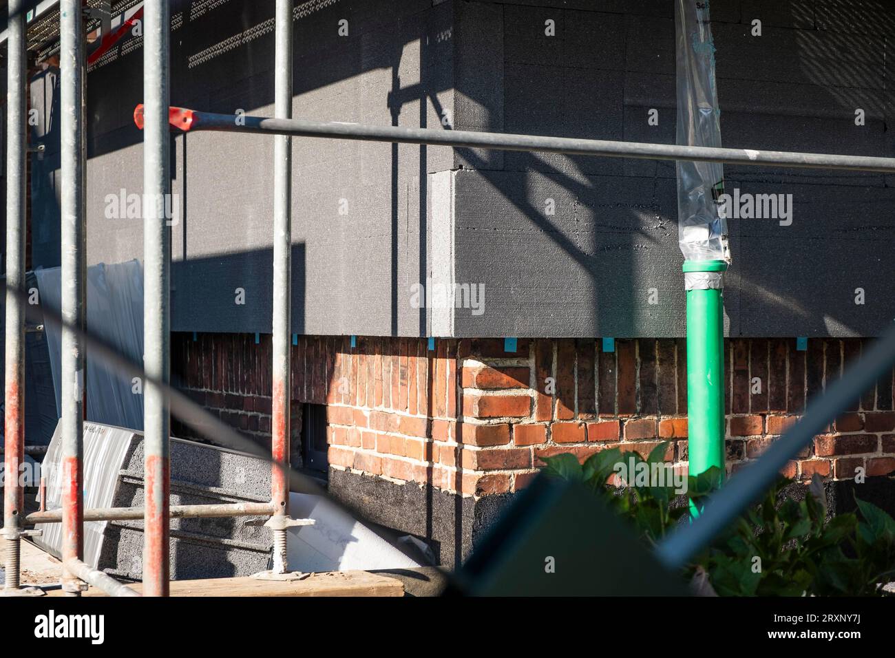 Insulation of a brick house facade with Polystorol insulation boards in