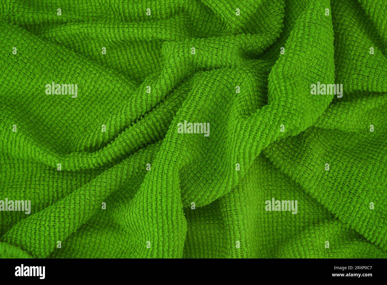 A green microfiber cleaning towel texture background. Close up. Stock Photo