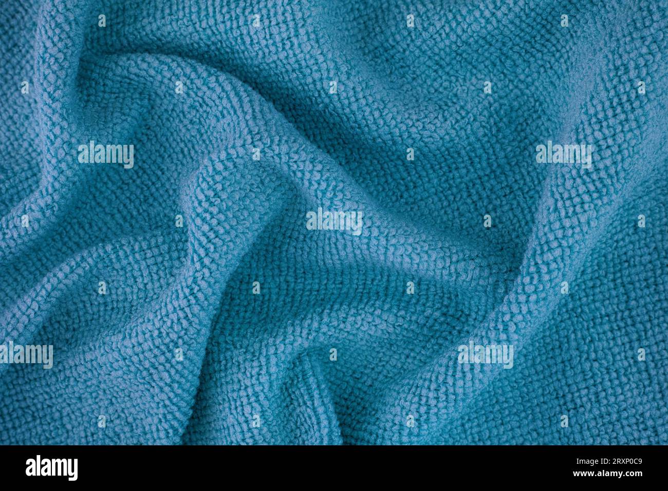 A blue microfiber cleaning towel texture background. Close up. Stock Photo