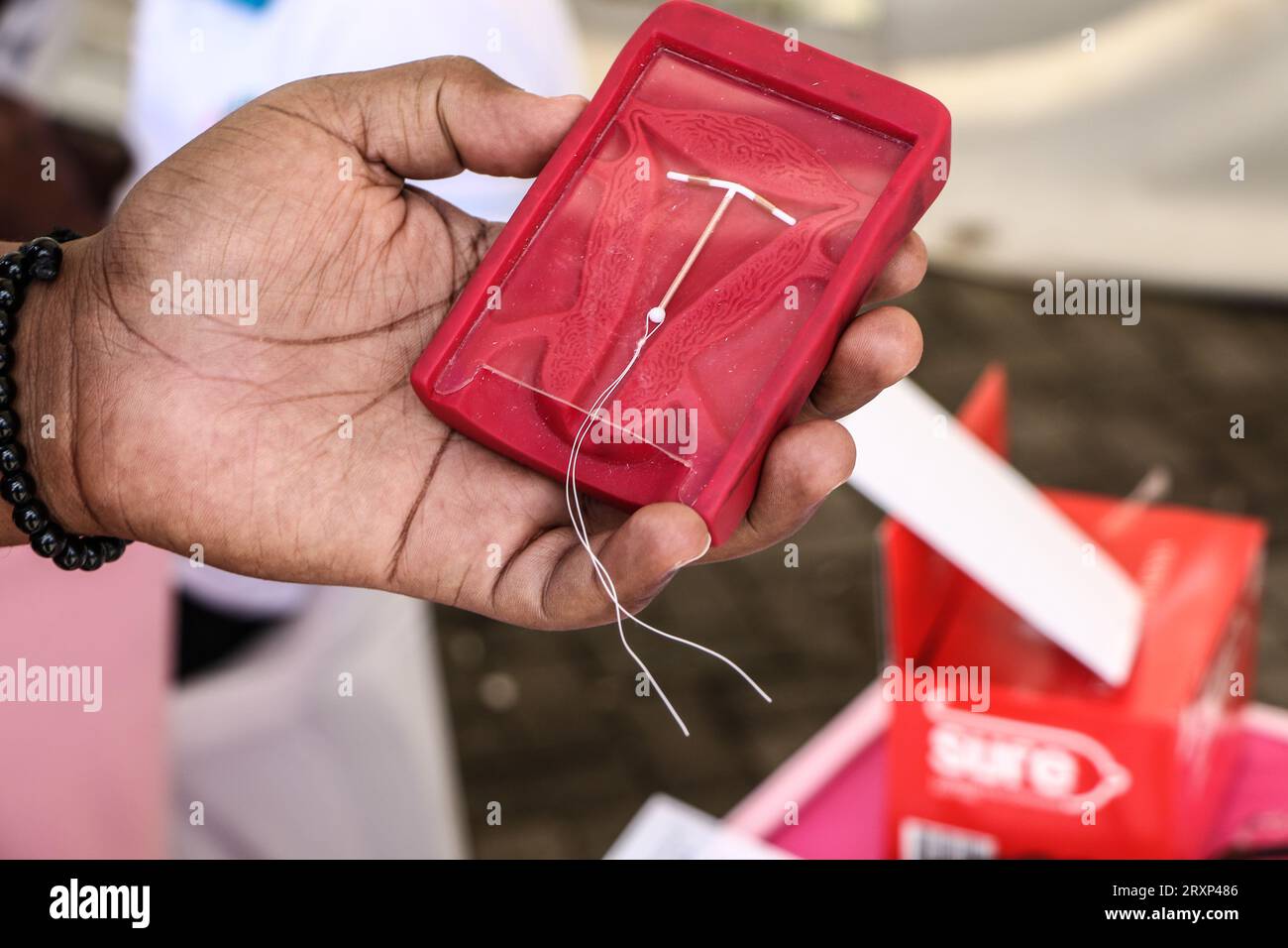 A close-up of a hand demonstrating the correct placement of an ...