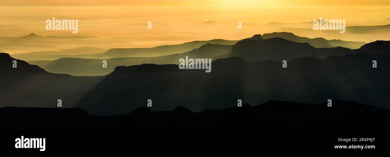 Drone view of Drakensberg Mountains at foggy sunrise, Kwazulu-Natal, South Africa Stock Photo