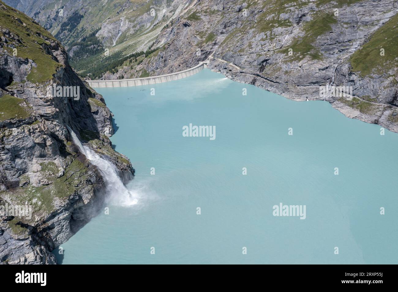 Dam of lake Mauvoisin, artificial channels in the rock fill the lake, valley  val de bagnes, Valais, Switzerland Stock Photo