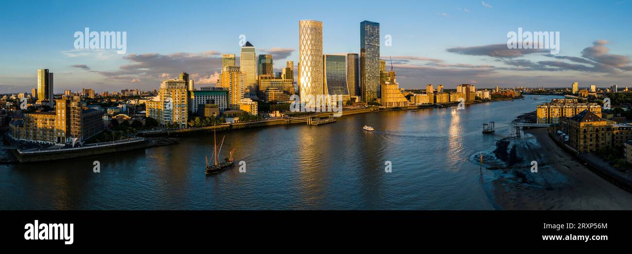 Drone view of river Thames and surrounding downtown skyscrapers at dusk, London, England, UK Stock Photo