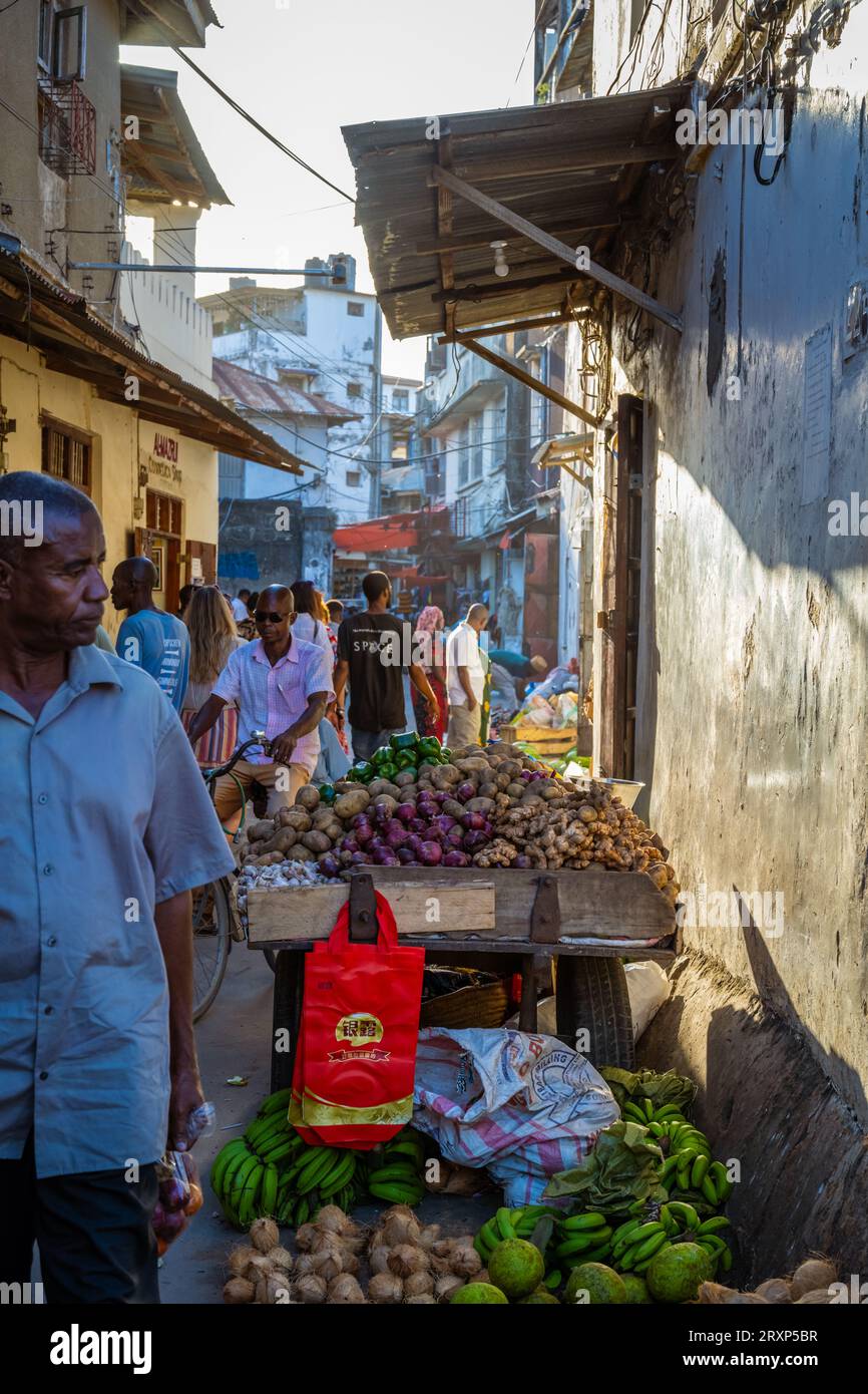 People in an alley at the market in Stone town, Zanzibar, Tanzania Stock Photo