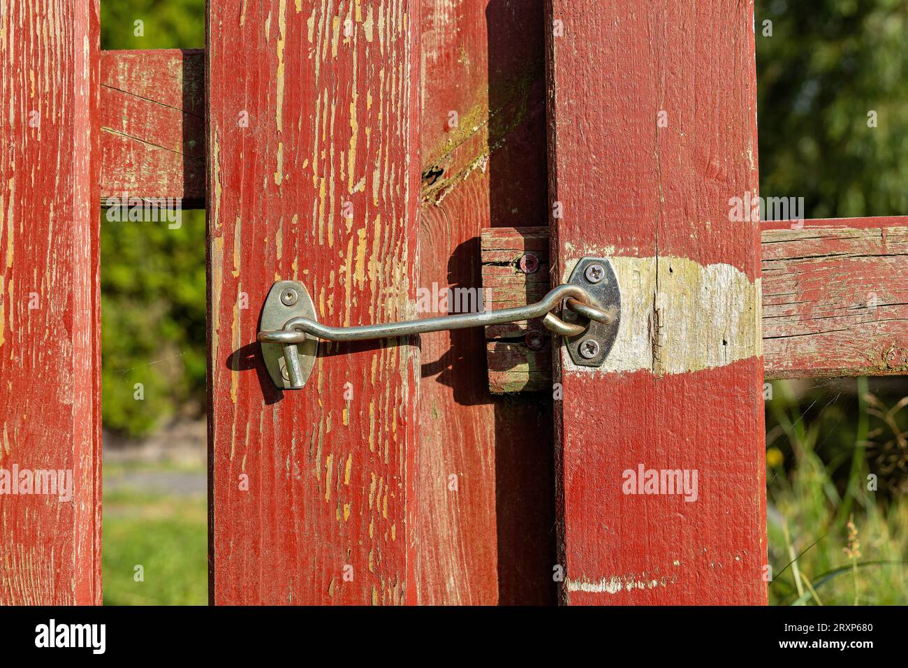 storm hook on wooden garden fence Stock Photo