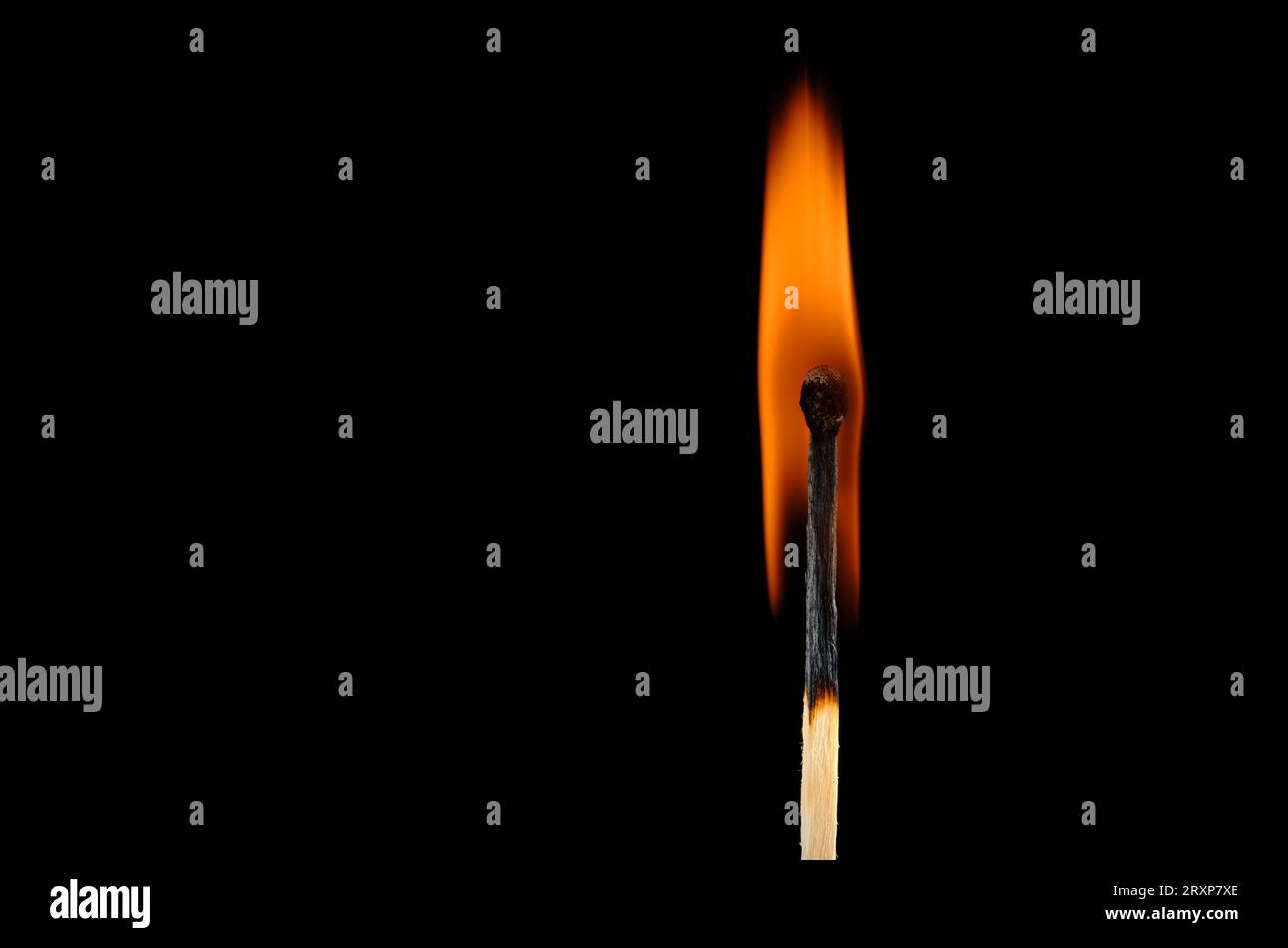 Orange flame burning match black background Stock Photo - Alamy