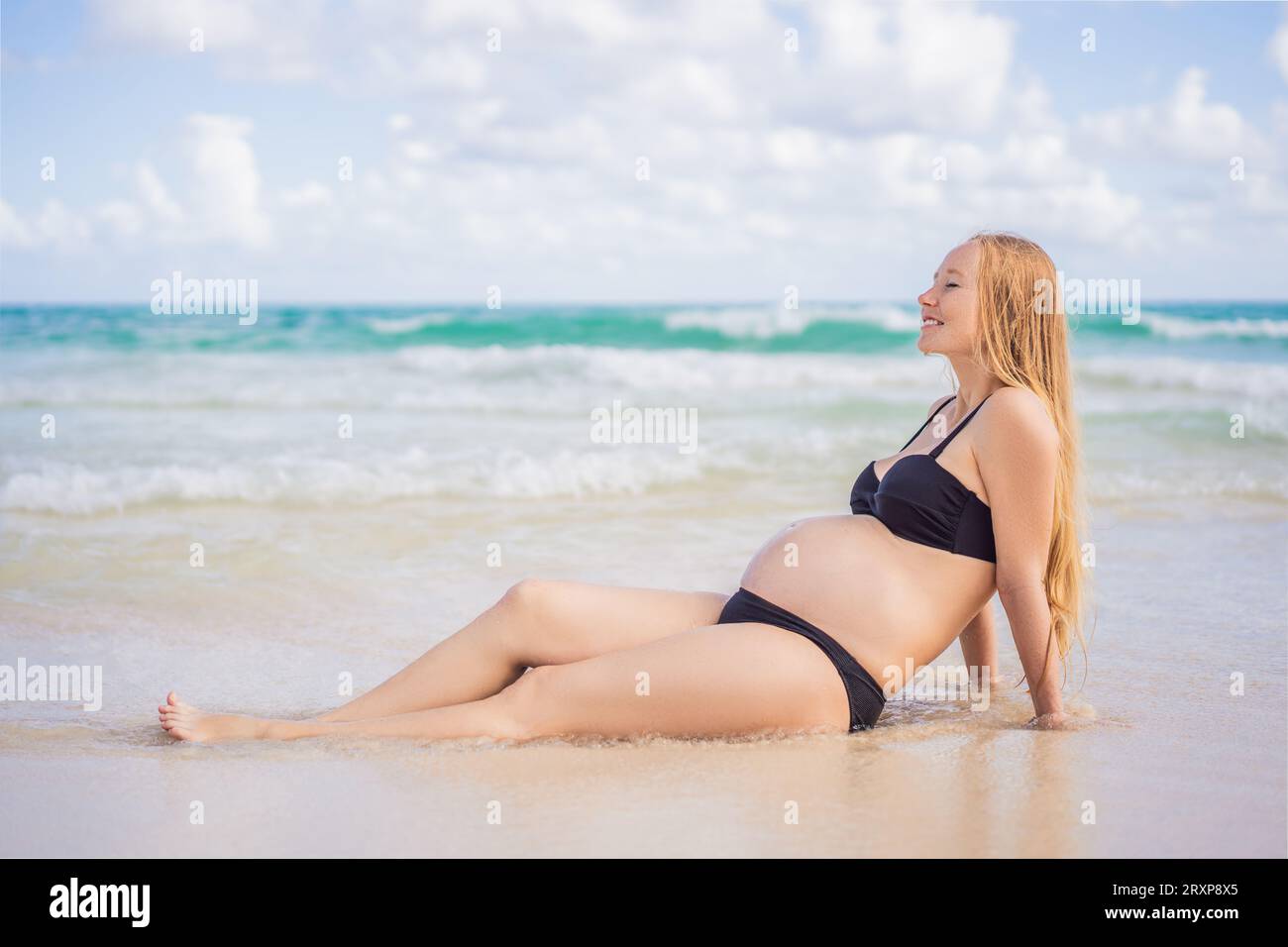 Pregnant swimsuit hi-res stock photography and images - Page 3 - Alamy