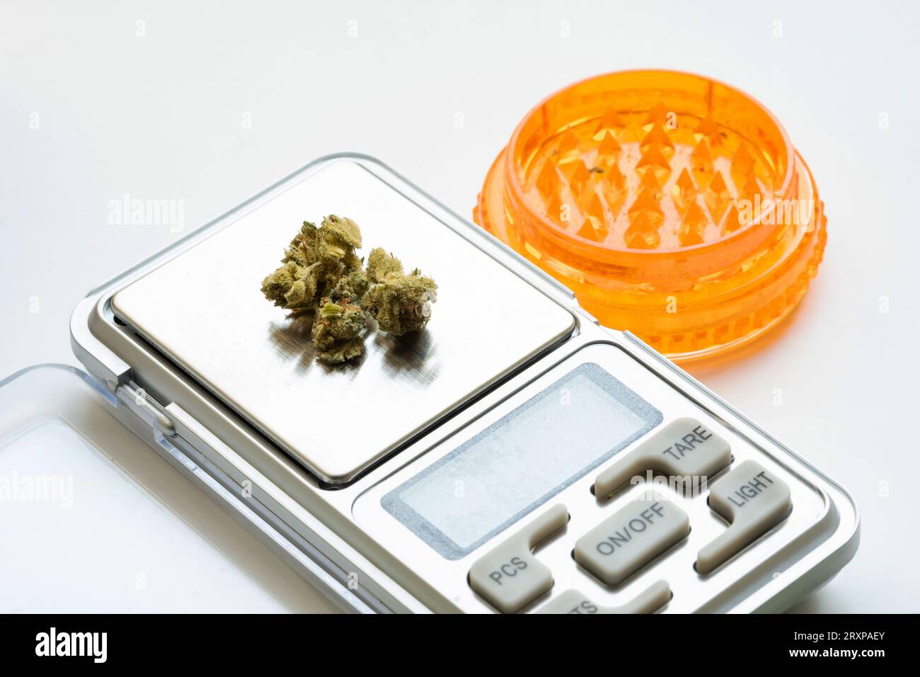 Weighing buds of medical cannabis marijuana on a electronic scale next