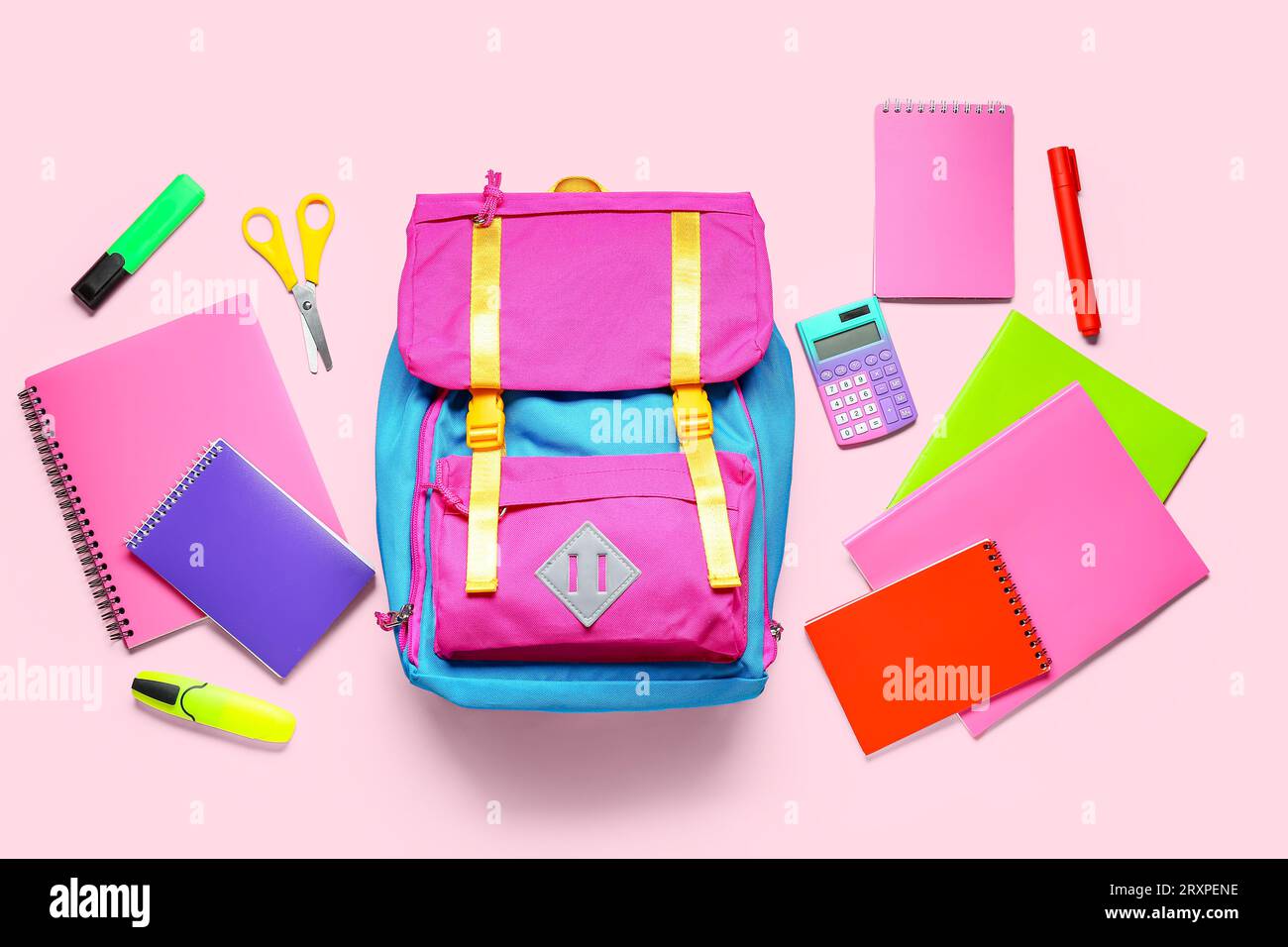 Stylish school backpack with different stationery on pink background Stock Photo