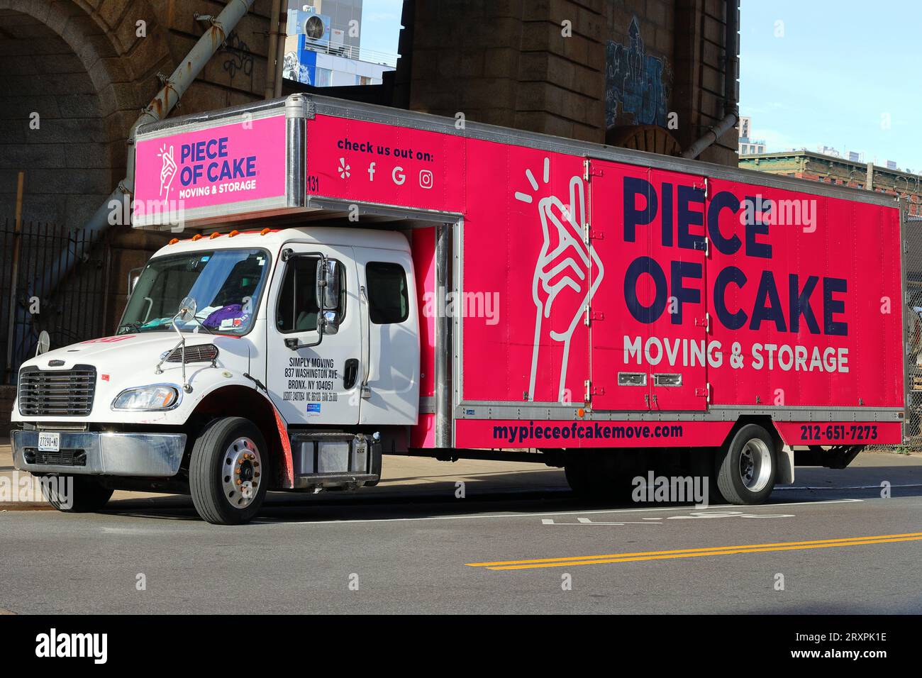 Piece of Cake Moving and Storage moving truck parked on a New York City street. Stock Photo