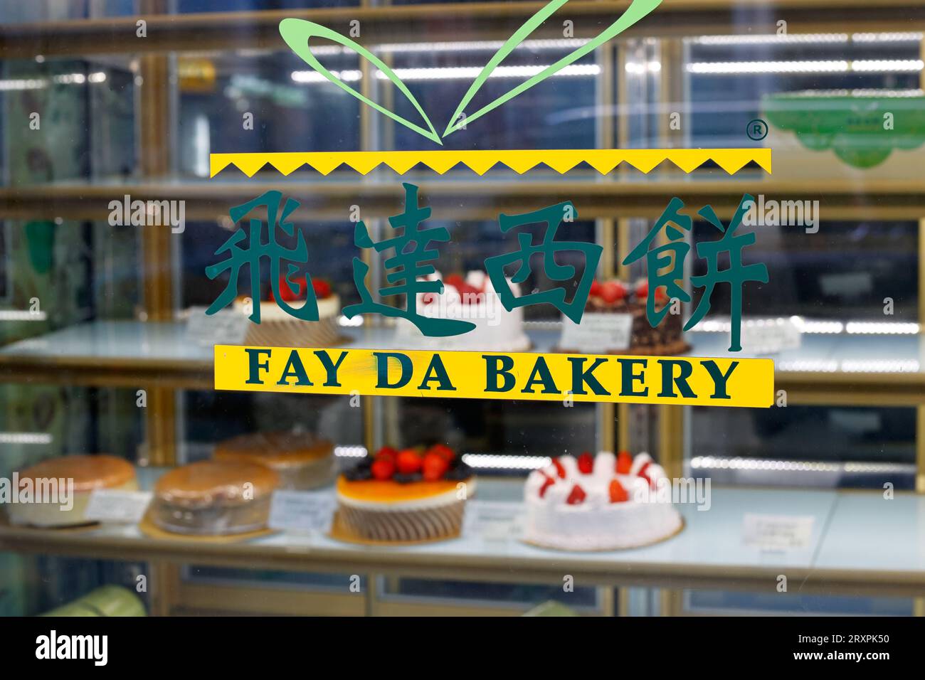 Signage for Fay Da Bakery 飛達西餅 on the window of one of their bakeries in Manhattan Chinatown, New York City. Stock Photo