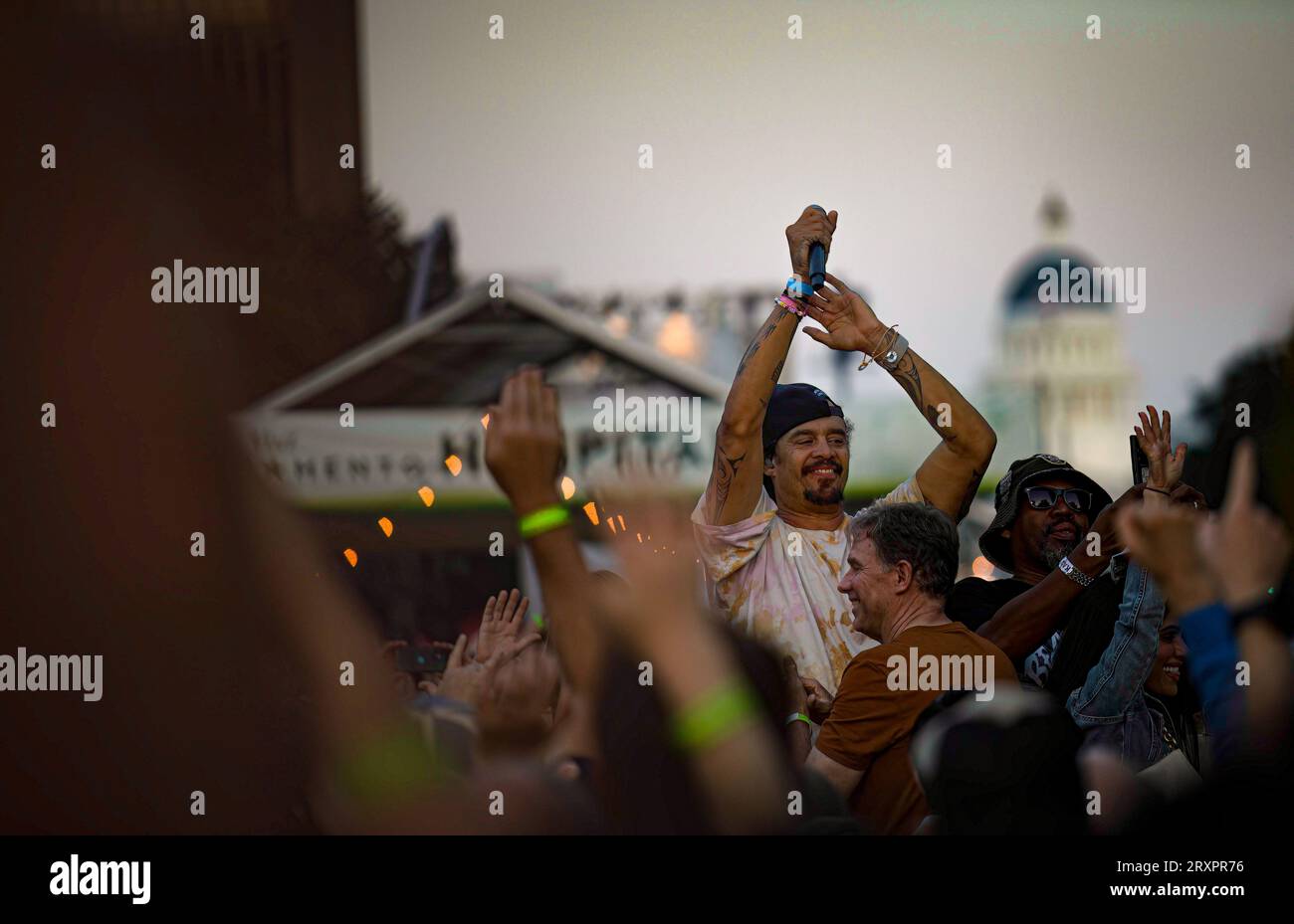 Michael Franti sings with his audience during his concert at the free Farm-to-Fork festival, held on the Capitol Mall by Visit Sacramento. Stock Photo