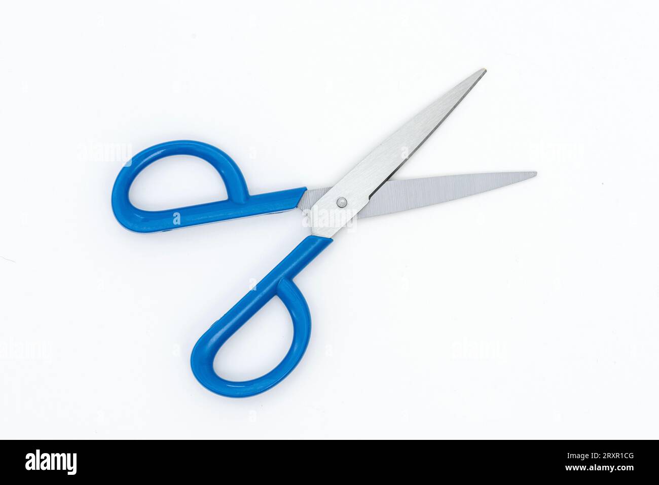 Blue scissors isolated on the white background. Stock Photo