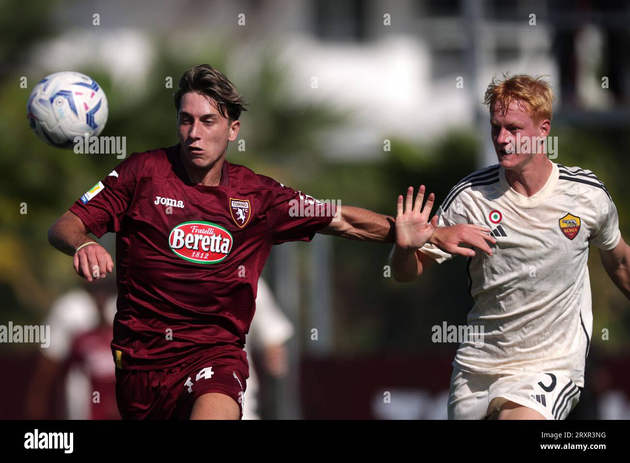 Turin, Italy. 24th Sep, 2023. Cristian Padula of Torino FC tussles with Lovro Golic of AS Roma during the Primavera 1 match at Stadio Valentino Mazzola, Turin. Picture credit should read: Jonathan Moscrop/Sportimage Credit: Sportimage Ltd/Alamy Live News Stock Photo
