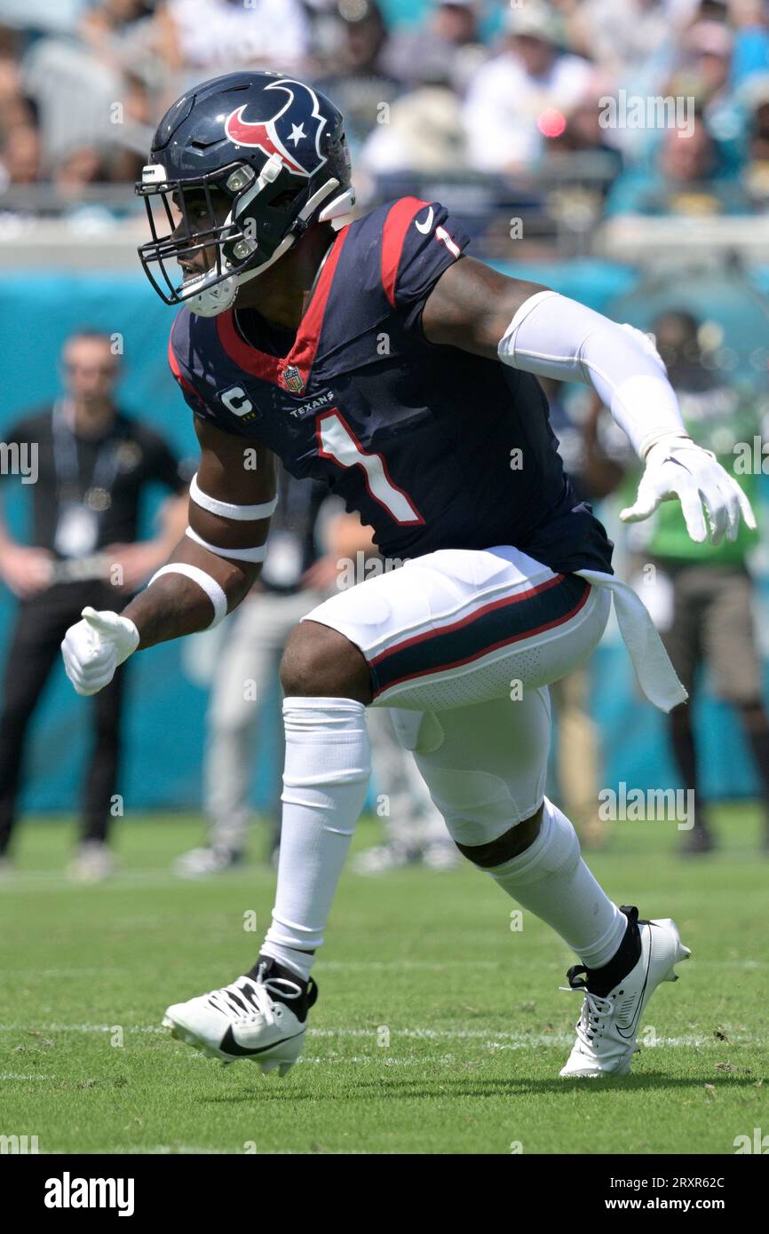 August 19, 2023: Miami Dolphins running back Salvon Ahmed (26) carries the  ball as Houston Texans safety Jimmie Ward (1) looks on after missing a  tackle during an NFL preseason game between