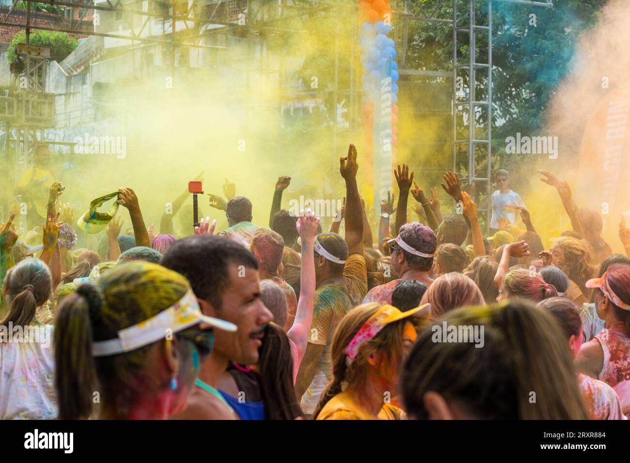 Salvador, Bahia, Brazil - March 22, 2015: Crowds of people are seen with their arms raised during the color run at Dique do Tororo in the city of Salv Stock Photo