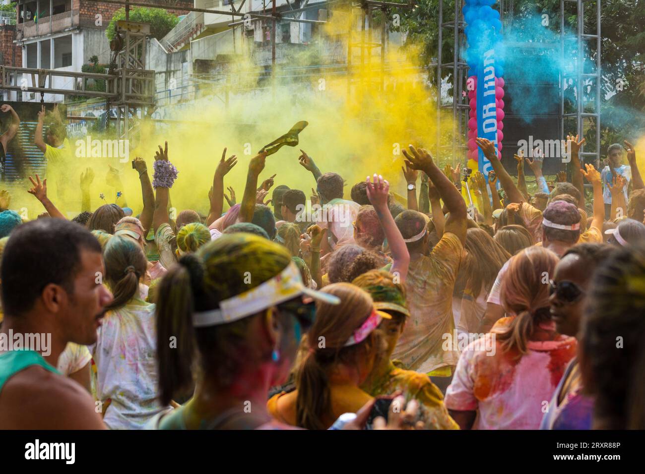 Salvador, Bahia, Brazil - March 22, 2015: Crowds of people are seen with their arms raised during the color run at Dique do Tororo in the city of Salv Stock Photo