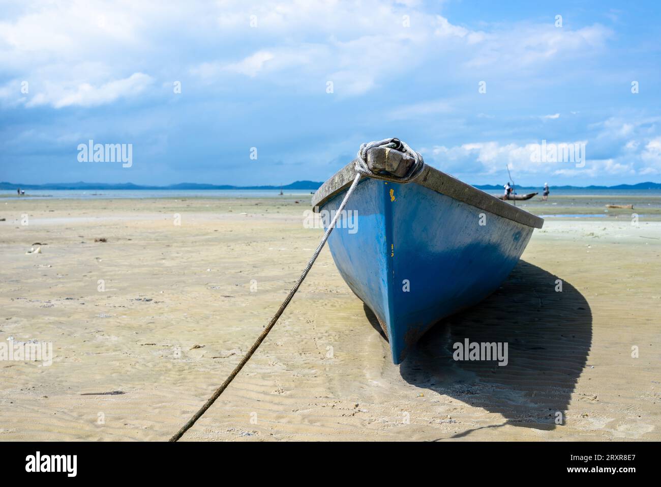 Santo Amaro, Bahia, Brazil - May 15, 2022: View of a boat anchored on Itapema beach in the Brazilian city of Santo Amaro, Bahia. Stock Photo