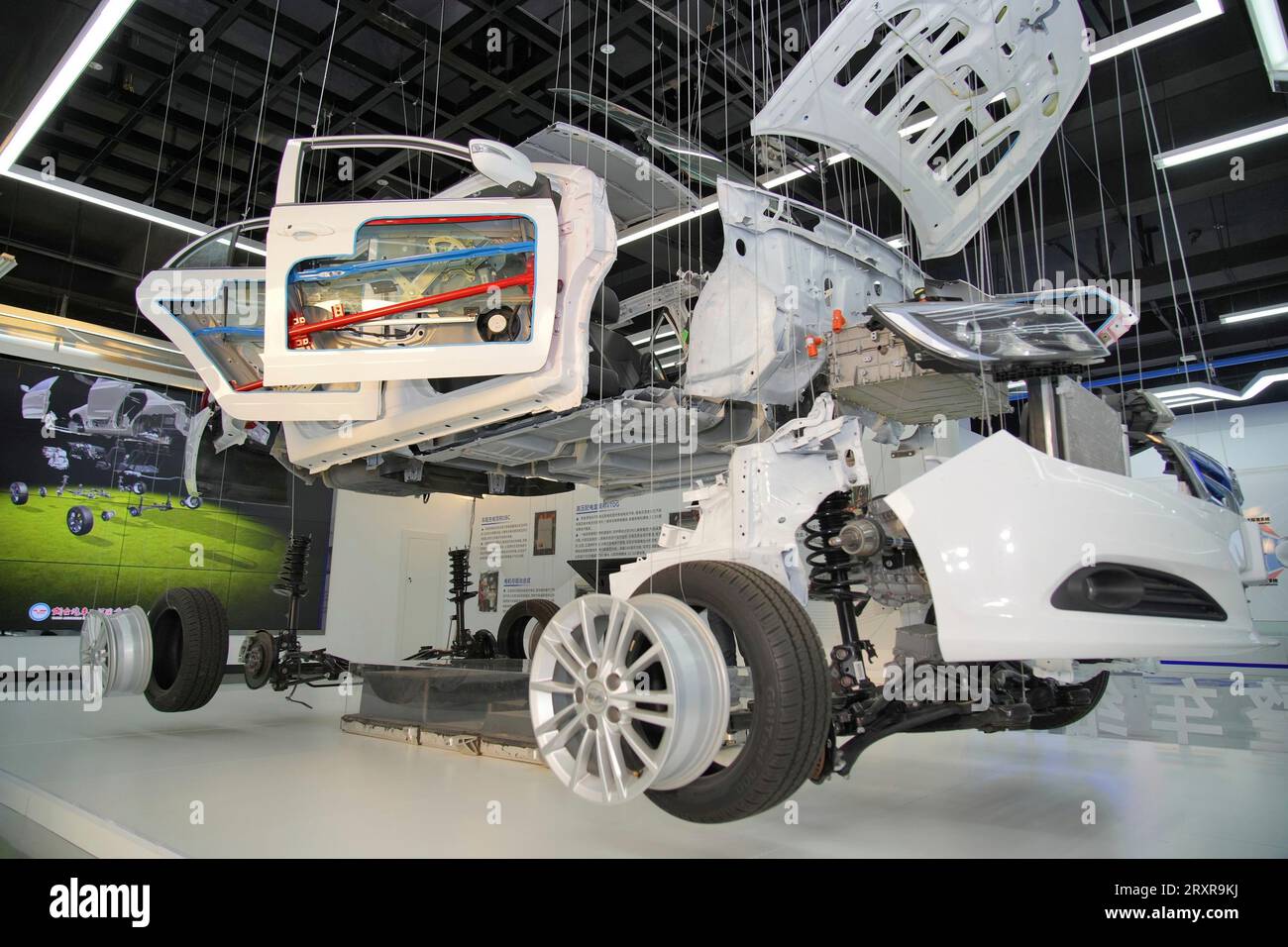 A display of the parts of a BYD passenger car at Yantai Automobile ...
