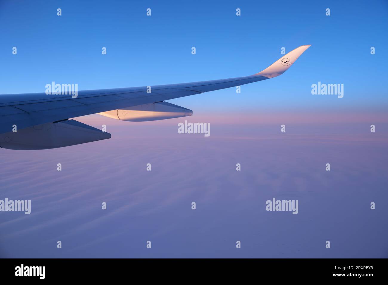 Lufthansa airplane wing and a view on a North Pole snowy landscape