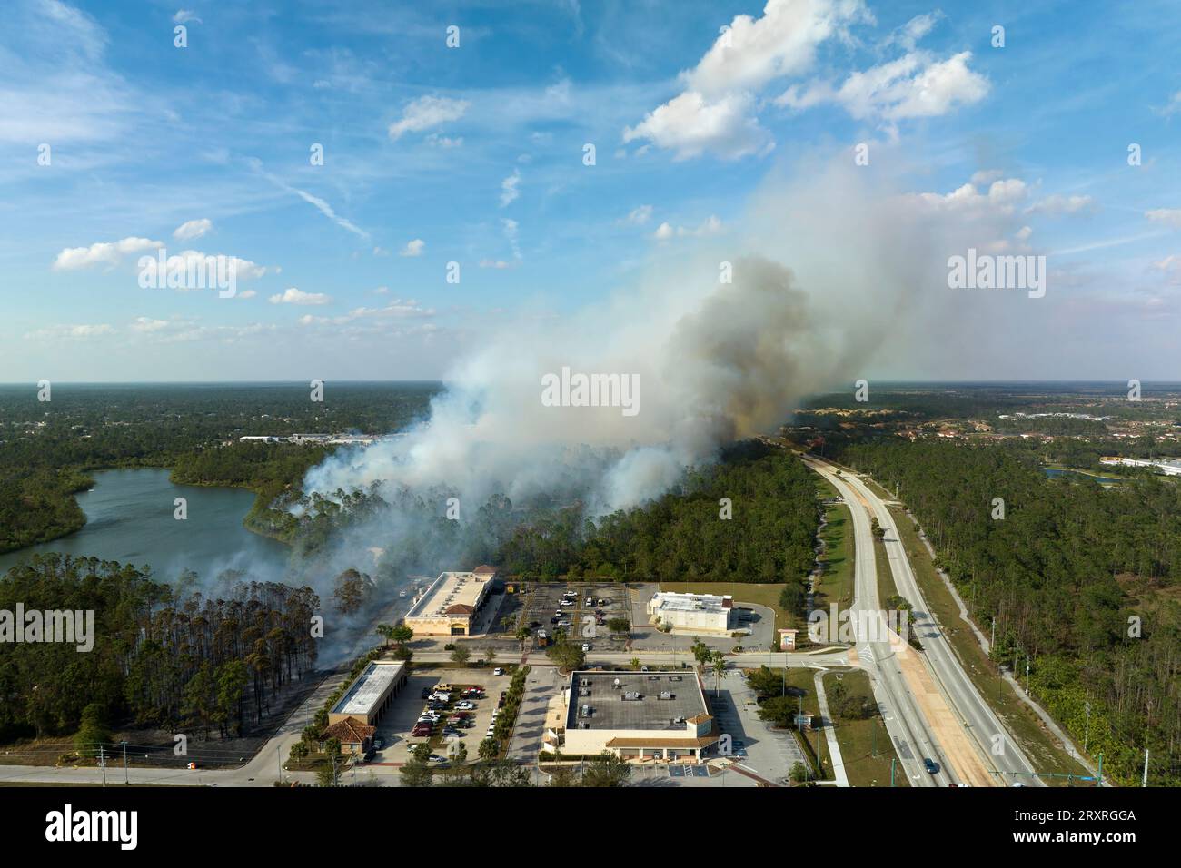 View from above of lagre wildfire burning severely in North Port city 