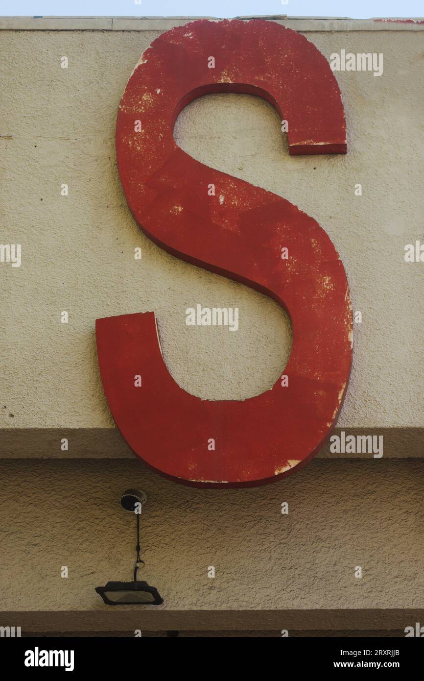 Old worn letter S, showing its age, pattern, lines and boldly grabbing attention.  Be noticed with this single letter, Stock Photo