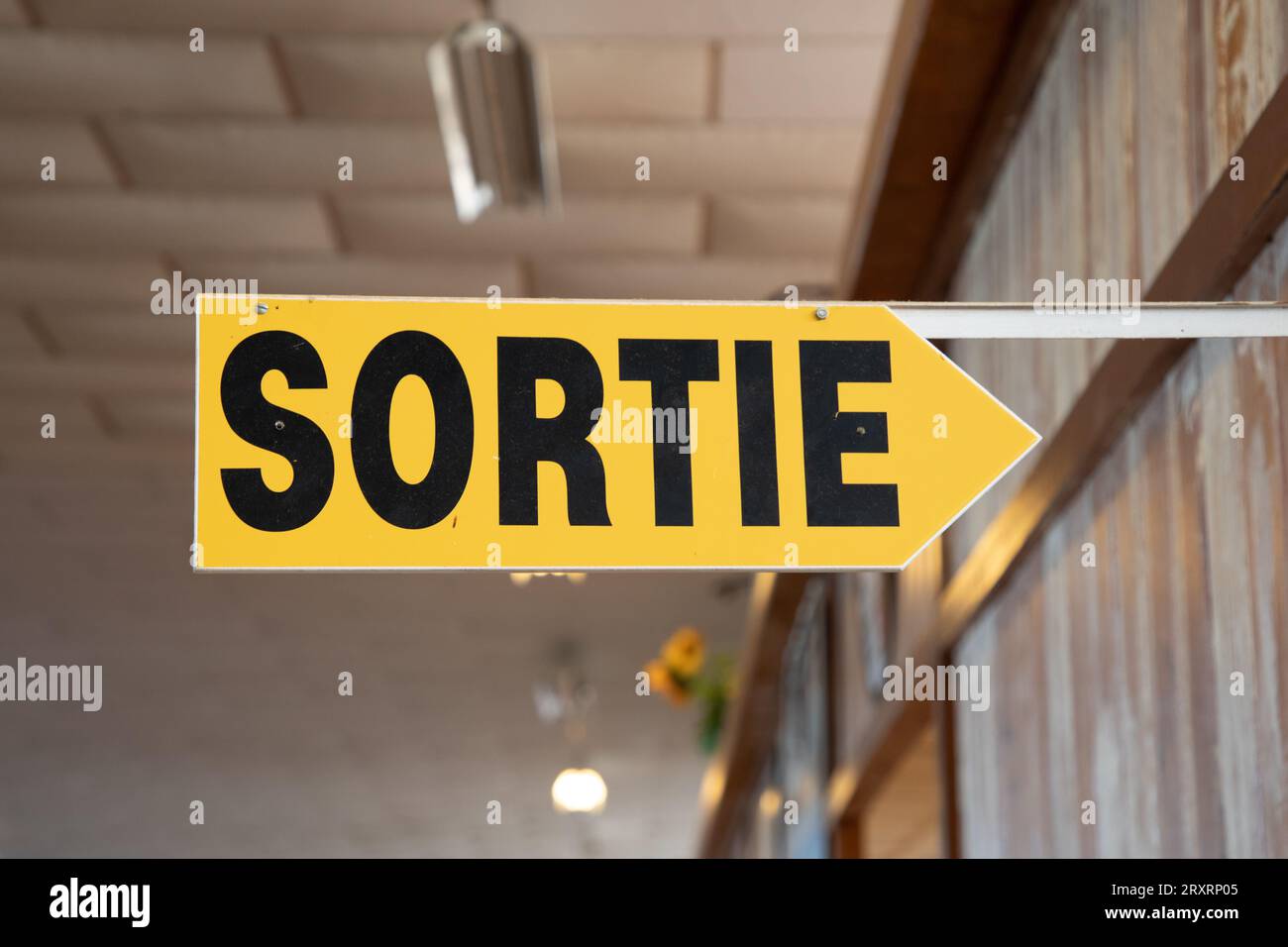 sortie french text means exit sign with yellow black arrow indicating