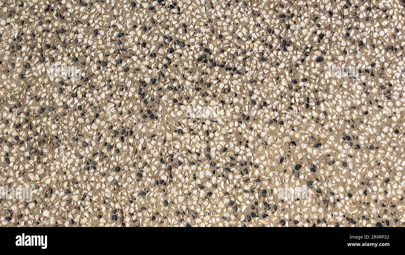 texture of stones on agglomerated crushed stone floor background Stock Photo