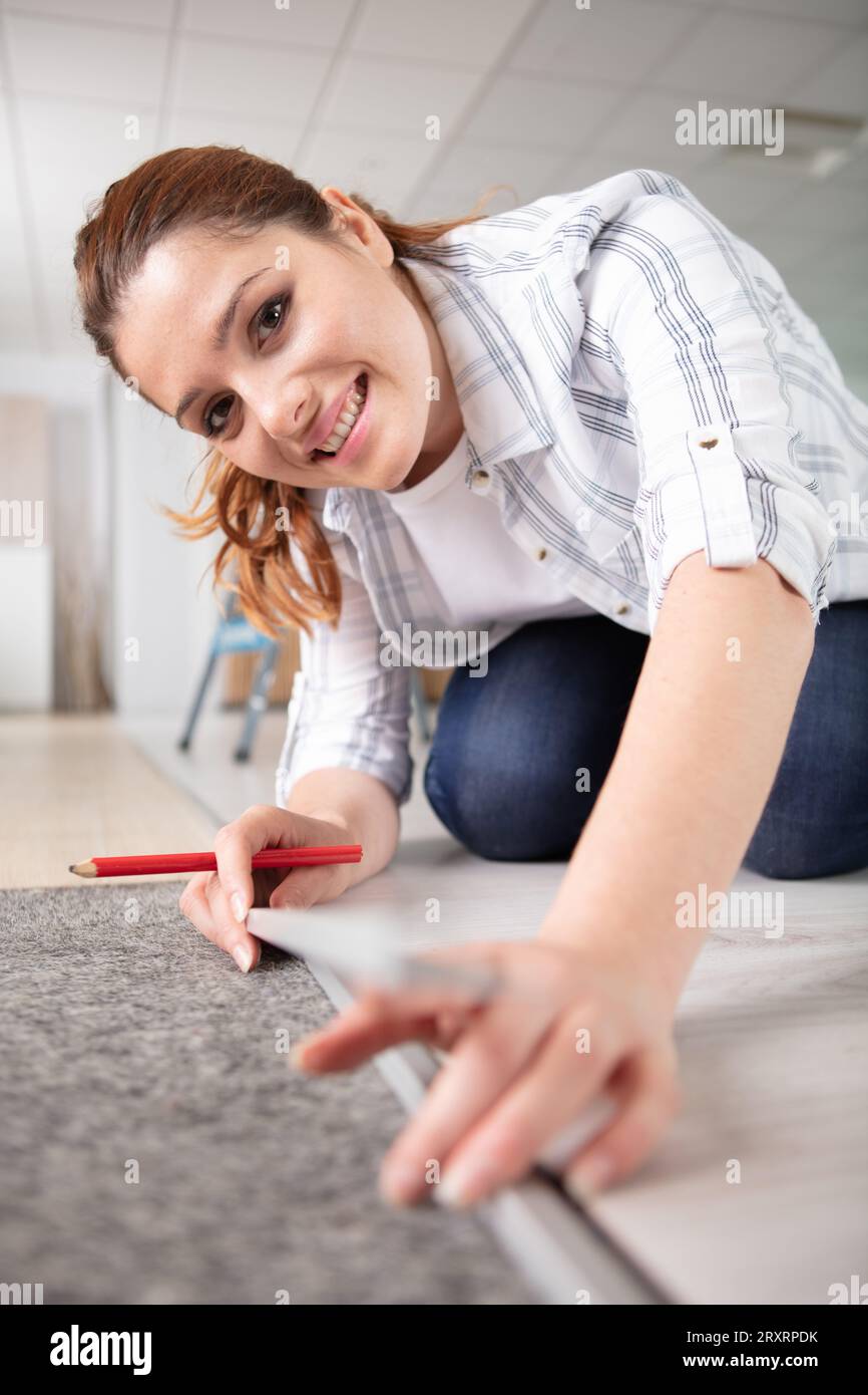 happy woman is happy about a new carpet Stock Photo