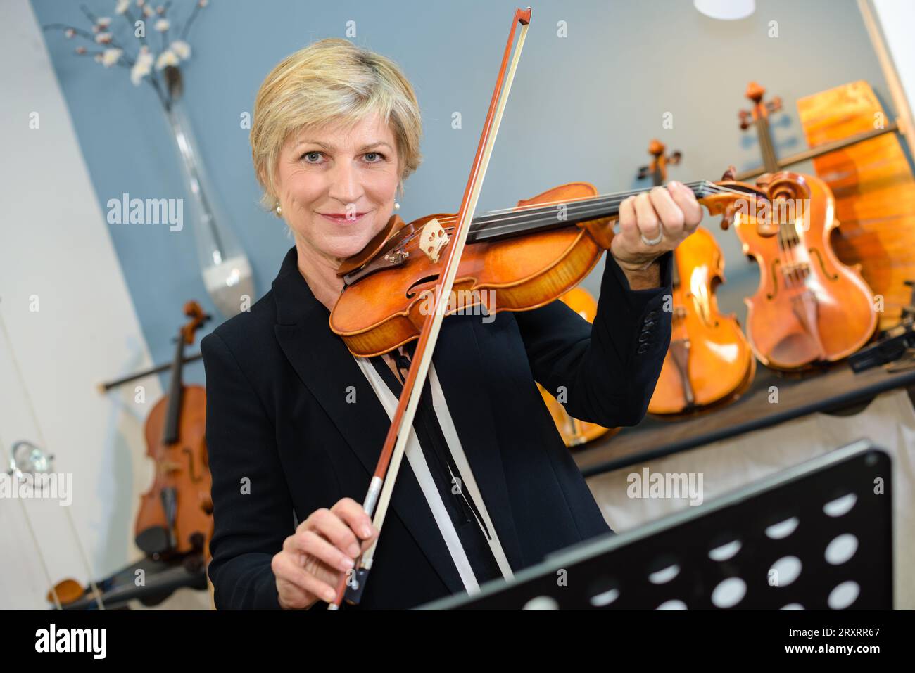 an elderly lady playing violin Stock Photo - Alamy