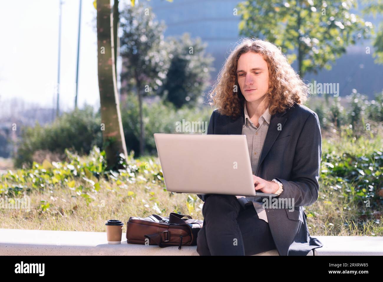 modern businessman working outdoors with a laptop Stock Photo