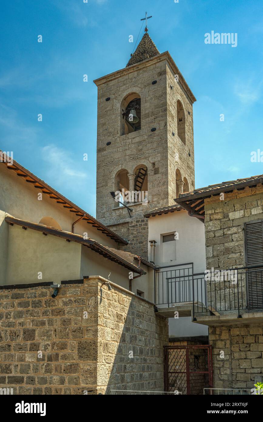 The bell tower of the church dedicated to San Lorenzo martyr located at the highest summit of the medieval village of Castel Trosino. Ascoli Piceno, M Stock Photo