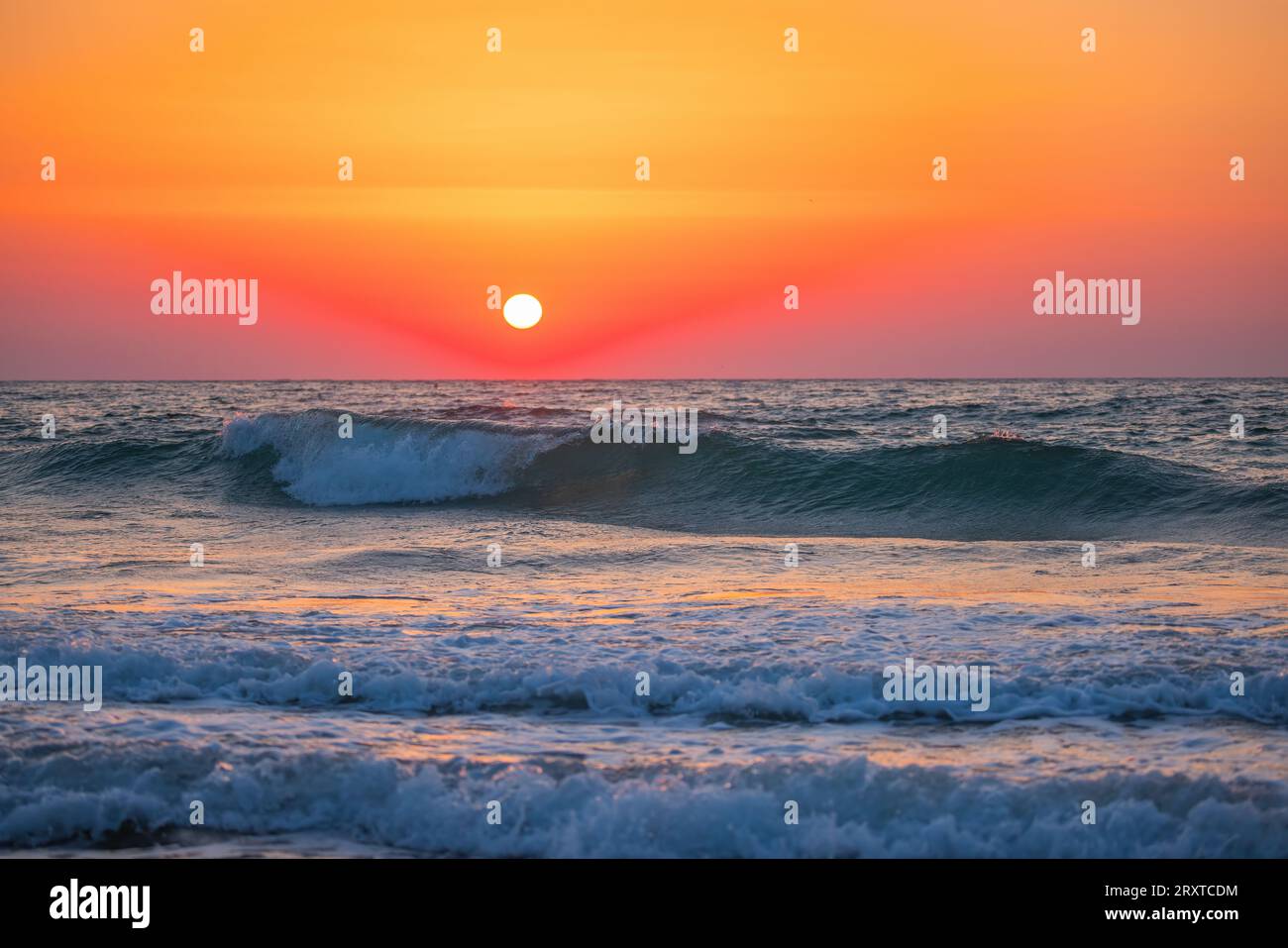 Beach ocean wave sunrise crashing hi-res stock photography and images ...