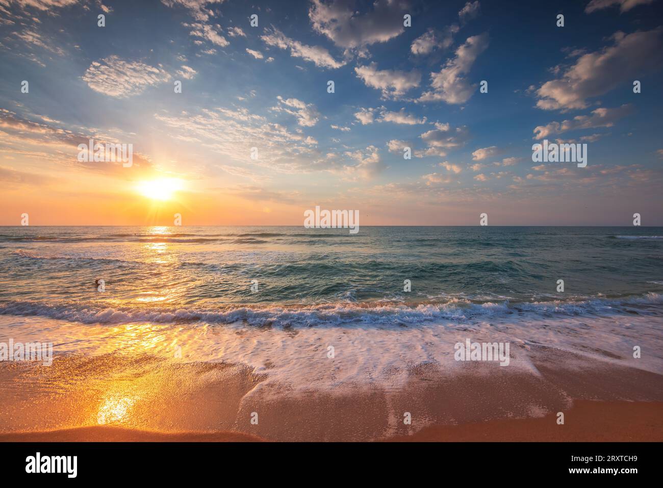 Beautiful sunrise over the tropical sea Stock Photo - Alamy