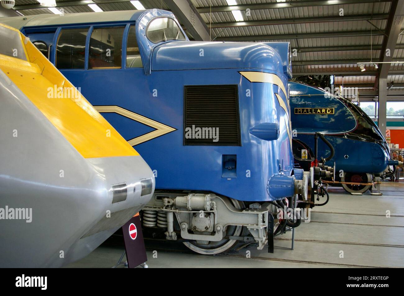 APT at the side of an English Electric Deltic Prototype Locomotive next to The Mallard. York, UK. Stock Photo